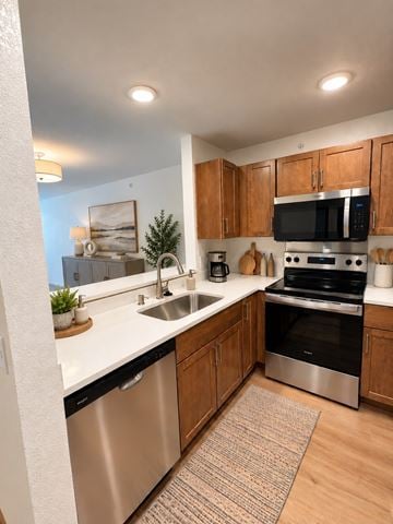 Menomonee Falls apartment for rent - A kitchen with a stainless steel dishwasher and oven.