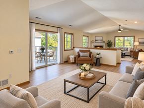 Menomonee Falls apartment for rent - A living room with a coffee table in the center and a fireplace in the background.