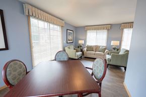 De Pere apartment for rent - A dining room with a wooden table and chairs.