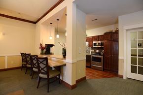 Mequon apartment for rent - Community Room Kitchen and Breakfast Bar at Highlands at Riverwalk Apartments 55+, Mequon, WI,53092