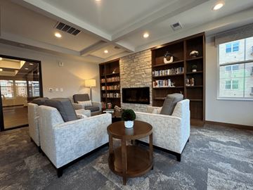 Menomonee Falls townhouse for rent - A living room with a grey carpet and a white sofa.