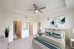 Middleton apartment for rent - a bedroom with a large bed and a ceiling fan