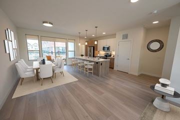Middleton apartment for rent - an open living room and kitchen with a dining room table and chairs