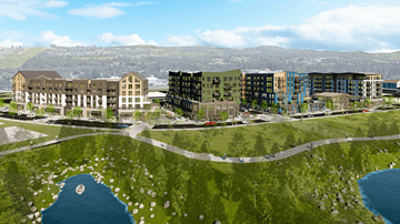 Washougal apartment for rent - A modern building complex is surrounded by a grassy area and a body of water.