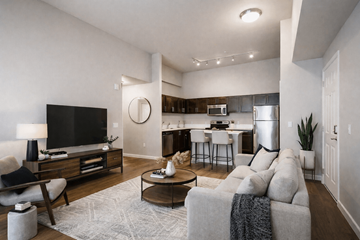 Portland apartment for rent - A modern living room with a grey couch and a wooden coffee table.