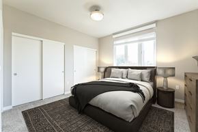 Beaverton apartment for rent - A bedroom with a large bed and a window.