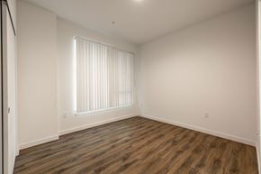Los Angeles apartment for rent - a bedroom with white walls and wood flooring and a window