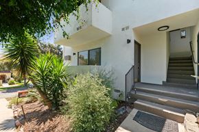 Pasadena apartment for rent - A white modern house with a tree in front.