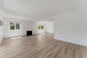 Pasadena apartment for rent - A room with wooden flooring and white walls.