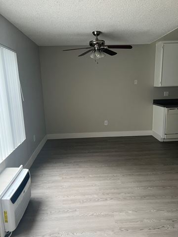 Santee apartment for rent - a living room with wood floors and a ceiling fan