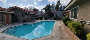 Lake Elsinore apartment for rent - Gated swimming pool and sun deck at Sierra Vista Apartment Homes in Lake Elsinore, California.