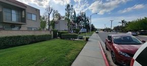 Lake Elsinore apartment for rent - Front gate and landscaping at Sierra Vista Apartment Homes in Lake Elsinore, California.