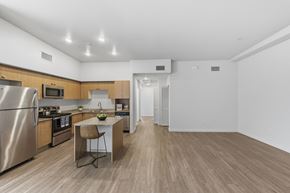 Escondido apartment for rent - A kitchen with a refrigerator, microwave, and oven.