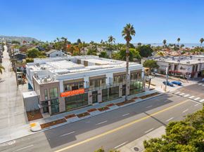 La Jolla apartment for rent - A street view of a building with a "Now Leasing" sign.