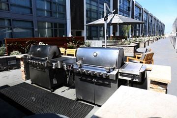 San Diego townhouse for rent - two bbq pits on a patio in front of a building