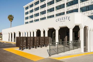 San Diego apartment for rent - A white building with arches and a sign that says Celeste.