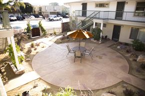 San Diego apartment for rent - Patio sitting area in courtyard at Harbor Villa Apartments in  San Diego, California.