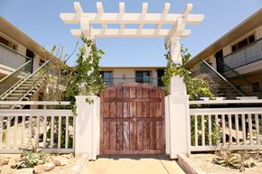 San Diego apartment for rent - Wooden gate enterance to Harbor Villa Apartments in San Diego, California.