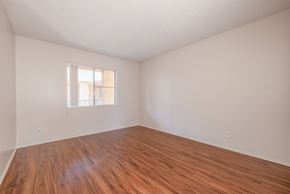 San Diego apartment for rent - A room with wooden flooring and a window.