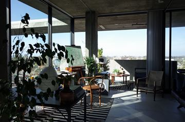 San Diego apartment for rent - A living room with a table and chairs and a view of the outdoors.