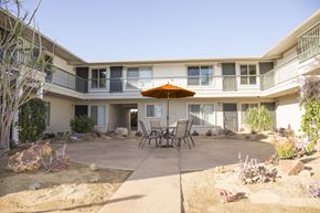 San Diego apartment for rent - Courtyard view of second floor units at Harbor Villa Apartments in San Diego, California.