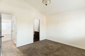 Escondido apartment for rent - Large carpeted bedrooms with shared bathroom and cathedral ceilings at The Nines Townhomes in Escondido, California.