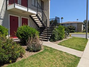 Santa Paula apartment for rent - Stairs to upper units and landscaping at Steckel Apartments in Santa Paula, California.