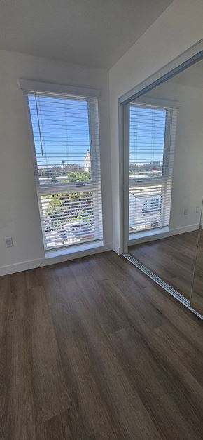 San Diego apartment for rent - A wooden staircase with a skylight above it.