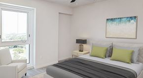 Clearwater apartment for rent - A bedroom with a bed, a chair, and a painting on the wall.