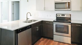 Clearwater apartment for rent - A modern kitchen with a stainless steel dishwasher and oven.