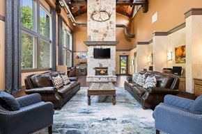 Denton apartment for rent - A living room with a fireplace and a stone mantle.