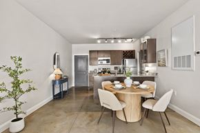 Leland apartment for rent - A dining room with a table set for two and a potted plant on the left.
