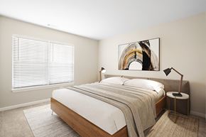 Canton apartment for rent - a bedroom with a large bed and a large painting on the wall