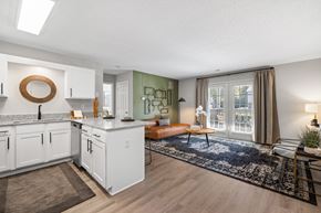 Greensboro apartment for rent - A modern kitchen with white cabinets and a large island.