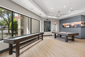 Irving apartment for rent - A room with a pool table and a bench.