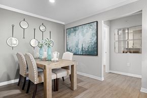 Tampa apartment for rent - A dining room with a wooden table and chairs.