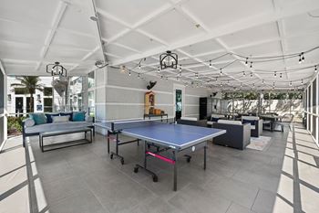 Outdoor patio with ping pong and lounge seating