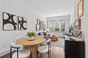 Sandy Springs apartment for rent - A modern dining room with a round table and chairs.