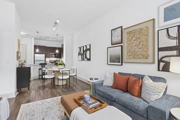 Sandy Springs apartment for rent - A living room with a grey couch and a coffee table.