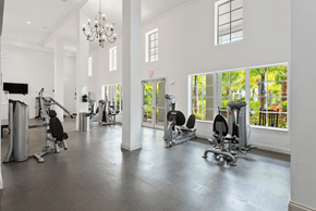 Pembroke Pines apartment for rent - A spacious gym with a variety of equipment and a balcony with a view.