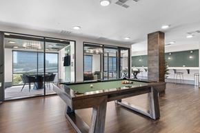 Lone Tree apartment for rent - A pool table in a room with a view of the city.