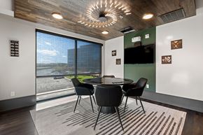 Lone Tree apartment for rent - A modern dining room with a round table and chairs.