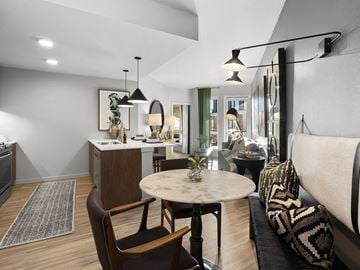Kirkland apartment for rent - a living room and kitchen area with a dining table and a couch