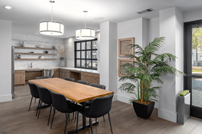 Dallas apartment for rent - A dining room with a wooden table and chairs.