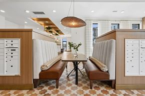 Charlotte apartment for rent - A modern dining room with a checkered floor and a wooden table.
