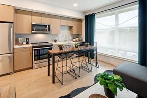 South San Francisco apartment for rent - a kitchen with a bar and a table with chairs