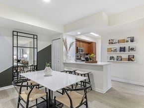 Fort Lauderdale apartment for rent - a dining room with a white table and chairs