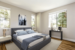 San Jose apartment for rent - A bedroom with a large bed and a painting on the wall.