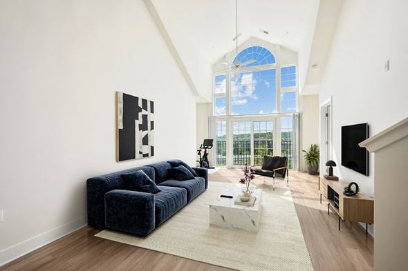 Arlington townhouse for rent - a living room with a blue couch and a large window