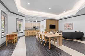 Orlando apartment for rent - A modern dining room with a wooden table and chairs.